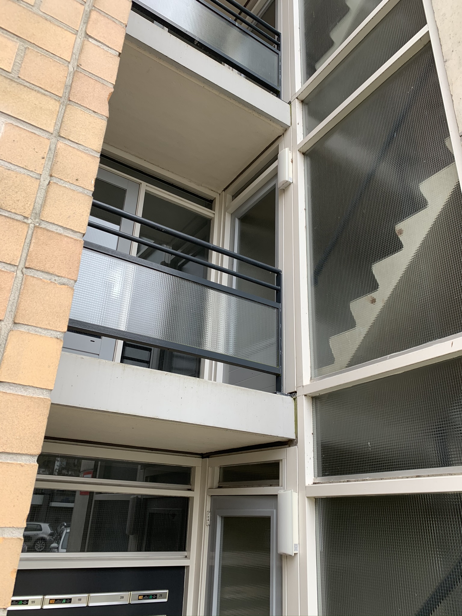 Project VvE Parktoren buitenschilderwerk balkon in Rotterdam.